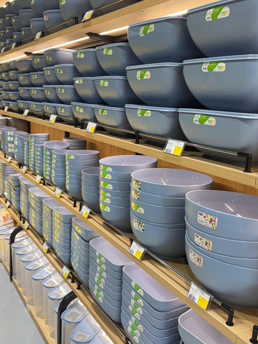 Wall of dusty-blue bowls and containers
